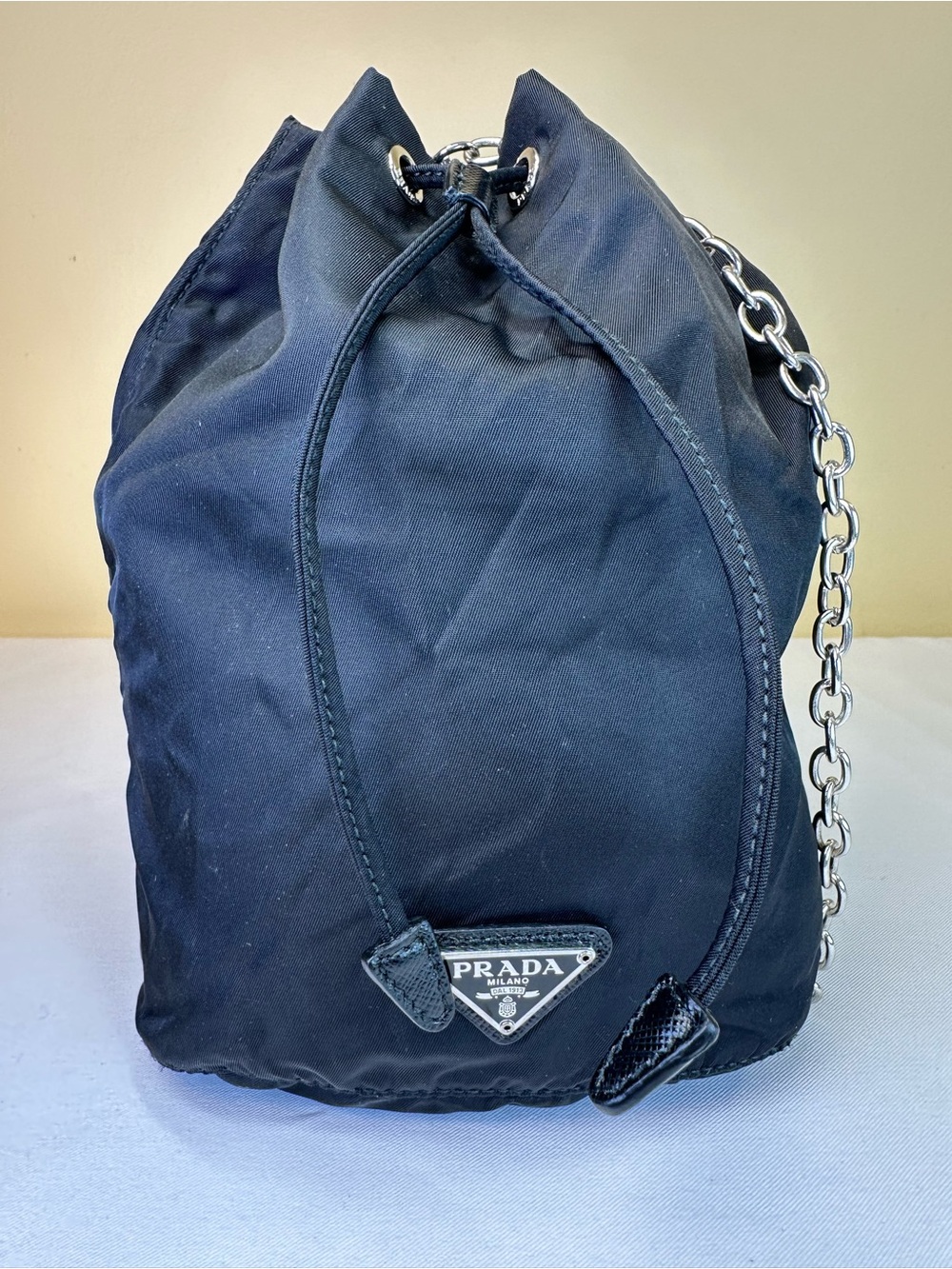 Prada Tessuto Re-Nylon Black Mini Drawstring pouch. COA